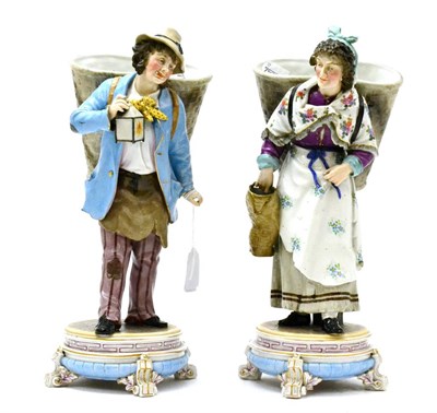 Lot 209 - Pair of late 19th century Continental figures modelled as a male and female with basket, height...