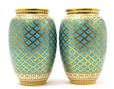 Lot 218 - A pair of Minton vases decorated with turquoise enamel with gilt highlights