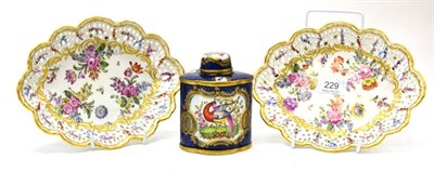 Lot 229 - A pair of Dresden porcelain pierced dishes and a scale blue tea caddy decorated with exotic birds