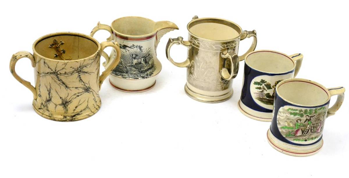 Lot 232 - Two Staffordshire frog mugs, a silver lustre tyg, a loving cup with a frog and two salamanders...