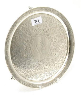 Lot 242 - A silver tray raised on three feet