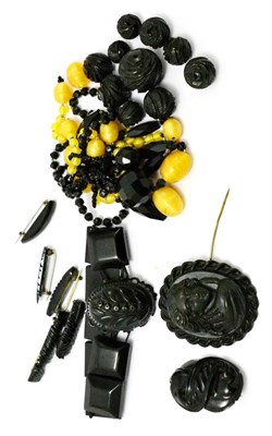 Lot 261 - A jet bracelet, carved jet beads, jet brooches, two brooches and a necklace (a.f.)