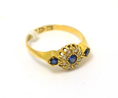 Lot 266 - An 18ct gold, sapphire and diamond ring