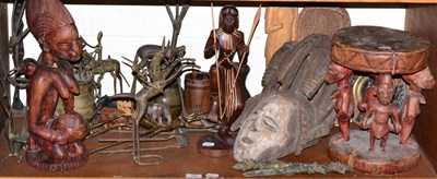 Lot 366 - A shelf of African Tribal art including Ashante and Lobi type metal figures of animals, a...