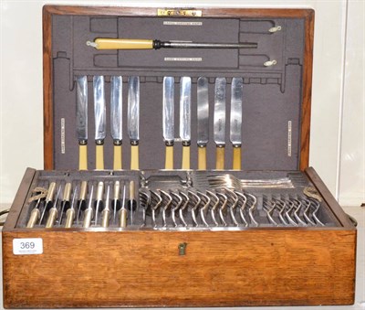 Lot 369 - An oak cased canteen containing a quantity of silver plated flatware for a twelve place setting