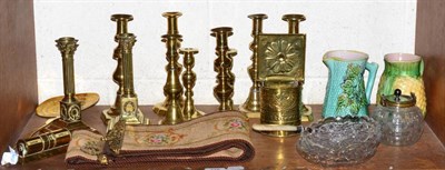 Lot 375 - A group of 19th century brass candlesticks, an early 20th century brass desk calendar, a bell pull