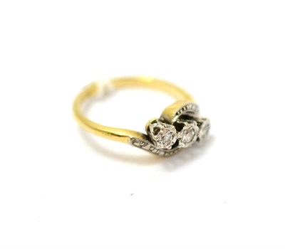 Lot 399 - A mid 20th century diamond three stone twist ring