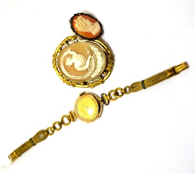 Lot 416 - A lady's 9ct gold wristwatch and two cameo brooches