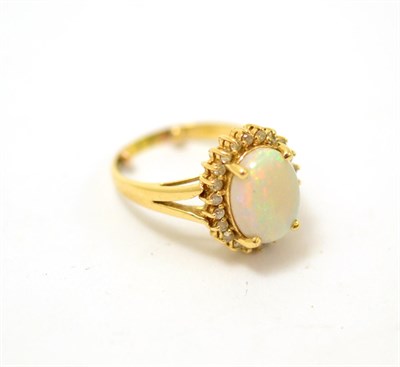 Lot 435 - Opal and diamond cluster ring