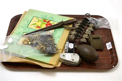 Lot 442 - A quantity of collectors' items including cap badges, lead soldiers, miniature camera form lighter