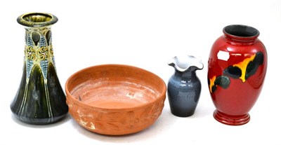 Lot 455 - A group including a C Brannam pottery bowl, two Poole vases and another vase