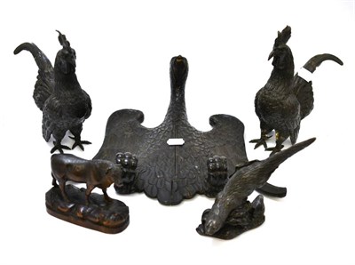 Lot 457 - An 18th century carved wooden furniture element in the form of an eagle together with a pair of...