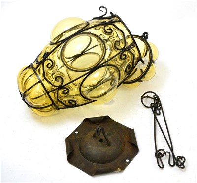 Lot 464 - A Venetian glass lantern with wrought iron decoration, circa 1940's