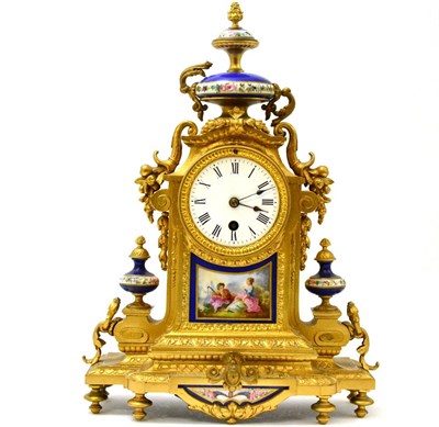 Lot 473 - A porcelain and gilt metal mantle clock