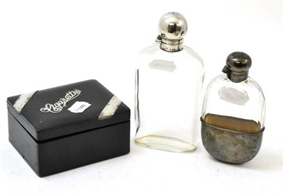 Lot 481 - Two silver mounter hip flasks, one with integral silver cup and a silver mounted ebonised cigarette