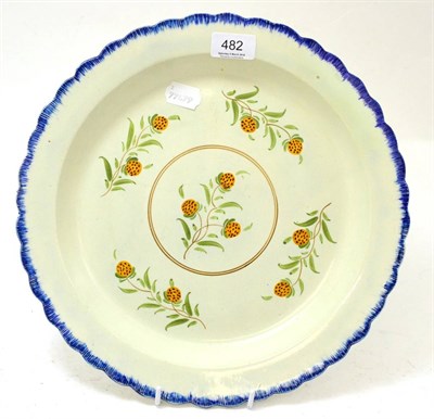 Lot 482 - A pearlware charger in Pratt colours, circa 1800, 34cm diameter