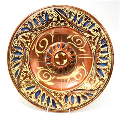 Lot 483 - A large 18th/19th century copper lustre charger, 39cm diameter