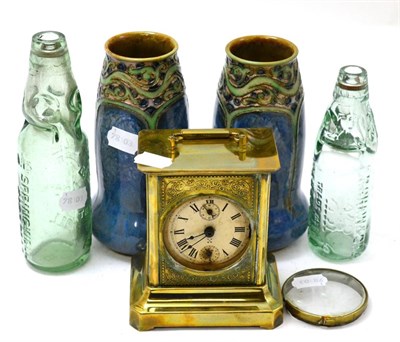 Lot 487 - A pair of Doulton vases, brass clock and two cordial bottles