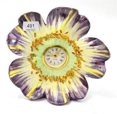 Lot 491 - A Delphin Massier Vallauris pottery flower head mantle clock