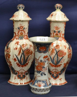 Lot 523 - A pair of Delft vases and covers painted with birds, together with a Japanese Imari vase circa 1700