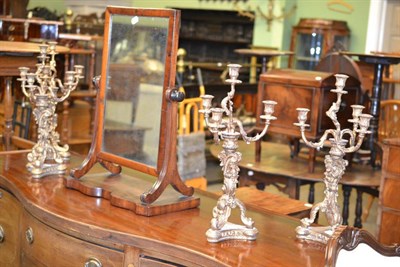 Lot 543 - A set of four gilt composition four light candelabra in the Rococo taste