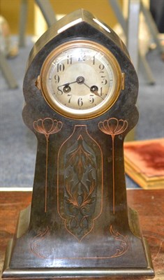 Lot 552 - An Art Nouveau German copper cased mantle clock