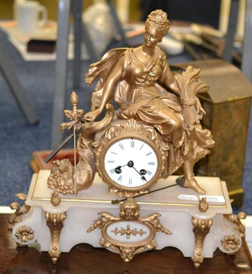 Lot 555 - A gilt metal and alabaster mantle clock, surmounted by a classical figure