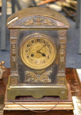 Lot 556 - A French gilt brass mantel clock on stand