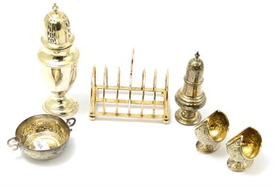 Lot 558 - A group of silver including a six division toast rack, a baluster form caster, small twin...