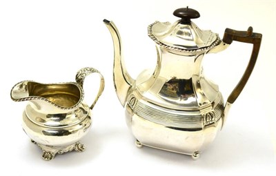 Lot 560 - A silver coffee pot and associated cream jug