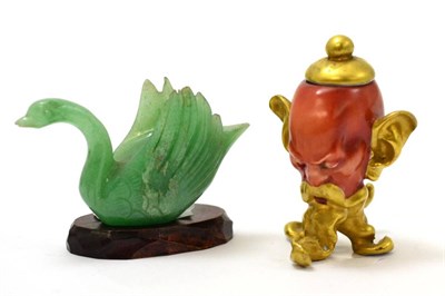 Lot 563 - A Capodimonte miniature vase and cover in the form of a mans head and a jade carving of a duck