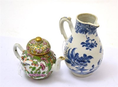 Lot 584 - An 18th century blue and white jug and a Canton teapot