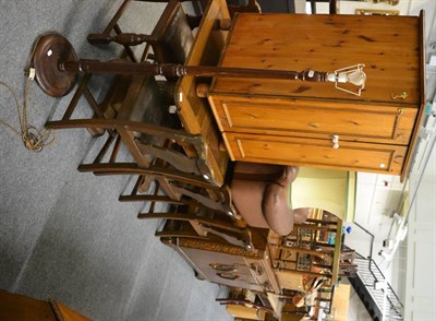 Lot 1015 - A 1920's oak draw leaf dining table with trestle base, together with six chairs, a matching...