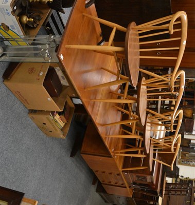 Lot 1018 - A teak dining table together with four Ercol style dining chairs and a Danish teak sideboard by...