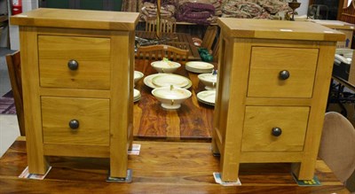 Lot 1082 - A pair of modern oak bedside cabinets