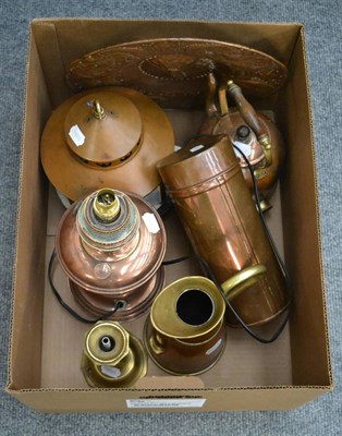 Lot 1132 - A group of copper and brass ware including a lamp, charger, jug, etc