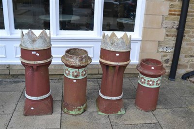 Lot 1155 - A group of four terracotta chimney pots