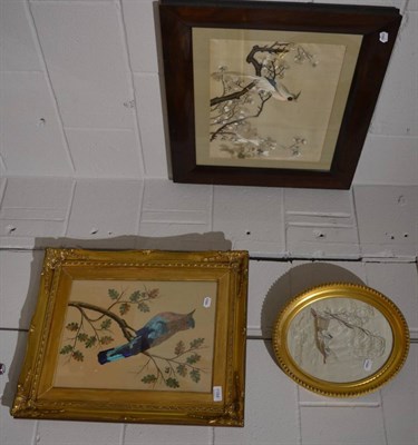 Lot 1184 - Group of three Oriental silk needlework pictures depicting birds in boughs, figure in boat etc