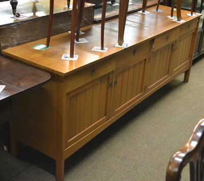 Lot 1308 - A teak sideboard