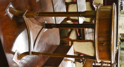 Lot 1309 - Walnut circular occasional table raised on three twin column supports and with waisted shelf...