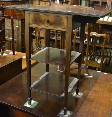 Lot 1311 - A Waring and Gillows mahogany drop leaf three tier occasional table fitted with a frieze drawer