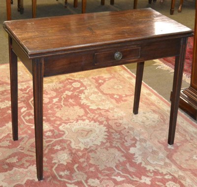 Lot 1331 - George III mahogany fold over tea table