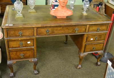 Lot 1336 - An early 20th century walnut twin pedestal writing desk