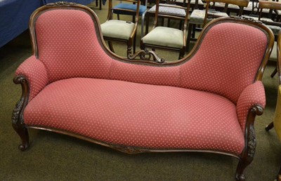 Lot 1357 - A double Chesterfield, upholstered in burgundy