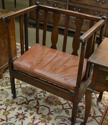 Lot 1367 - A 19th century mahogany slatted hall seat, with down scrolled arms and drop in seat