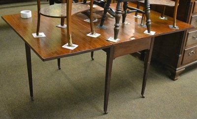 Lot 1378 - A 19th century mahogany gateleg dining table