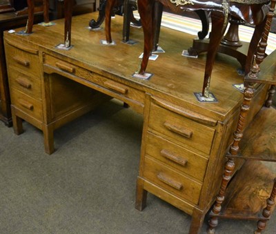 Lot 1385 - An oak partners desk