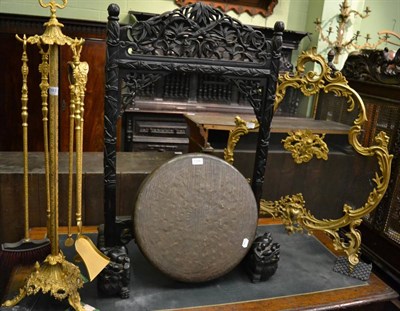 Lot 1393 - A gilt metal Rococo style mesh fire screen and a matching companion set