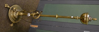 Lot 1415 - A 19th century brass oil lamp stand later converted to an electrical standard lamp