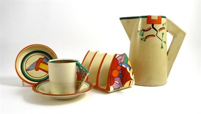 Lot 8 - Four Clarice Cliff ceramic items including a toast rack, pin dish, coffee can and saucer and a...
